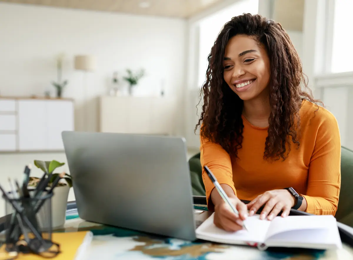 Happy student taking an online Korean lesson to learn Korean language for beginners